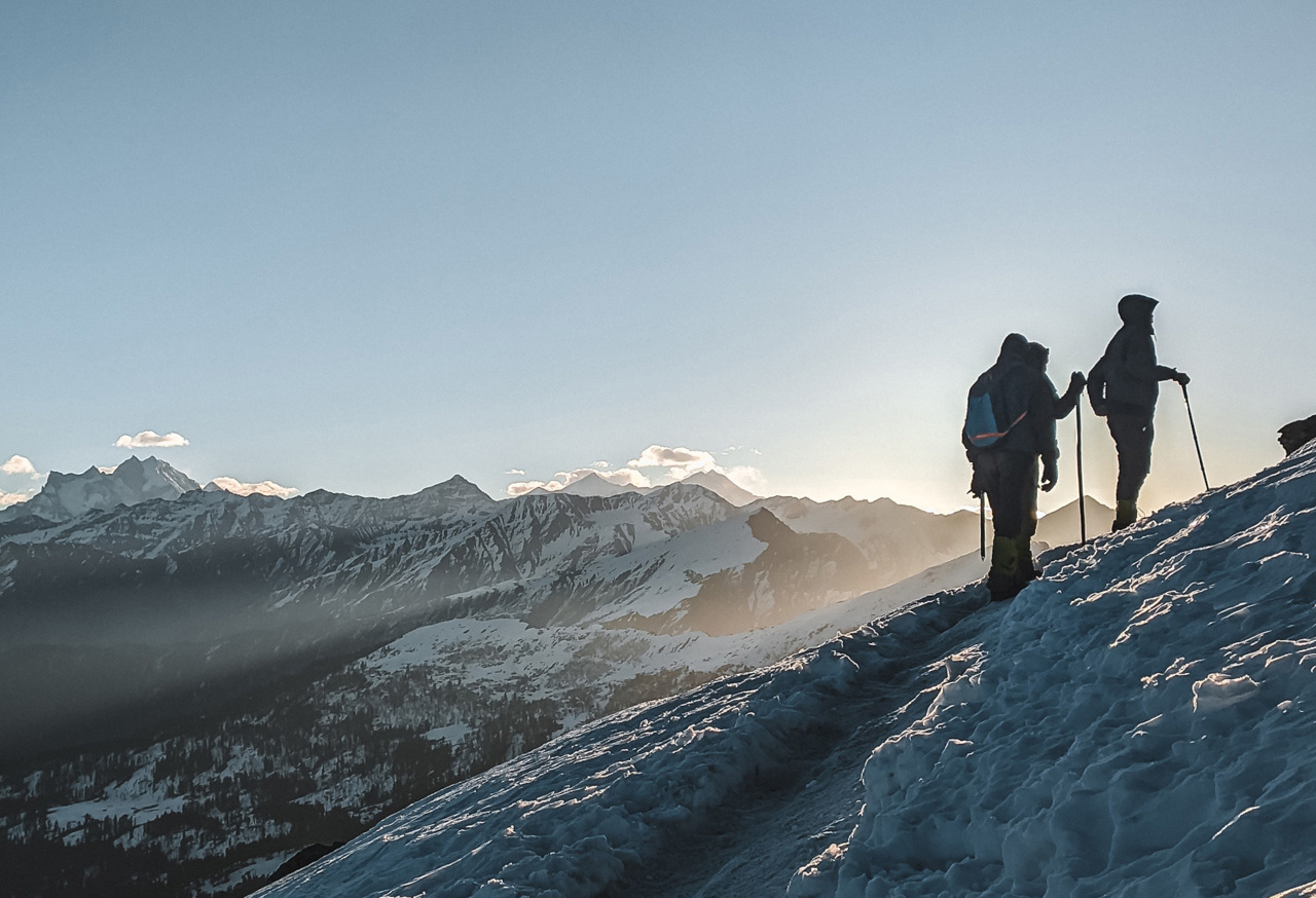Hikers going up a snowy mountain
