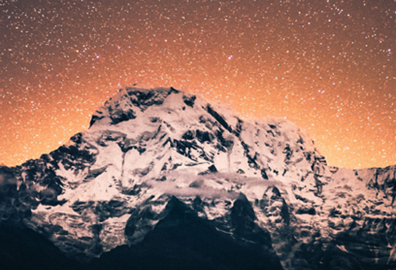 Snowy mountain and starry sky